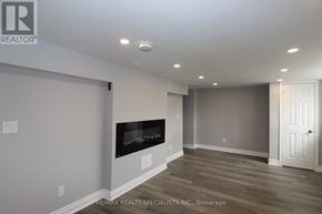 Brampton (Northwood Park) apartment for rent - A room with a fireplace and a door on the right side.