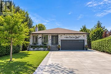 Toronto (Eglinton East) apartment for rent - A house with a garage and a driveway in front.