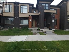 Brampton (Northwest Brampton) townhouse for rent - A row of houses with the text HOMELIFE/MIRACLE REALTY LTD, Brokerage on the bottom.
