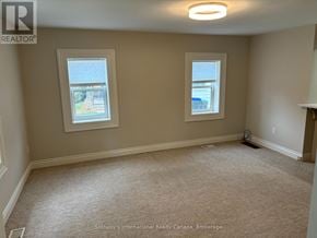 Collingwood apartment for rent - A room with two windows and a carpeted floor.