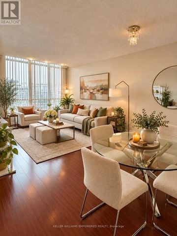 Vaughan (Crestwood-Springfarm-Yorkhill) condo for rent - A modern living room with a glass table and white chairs.
