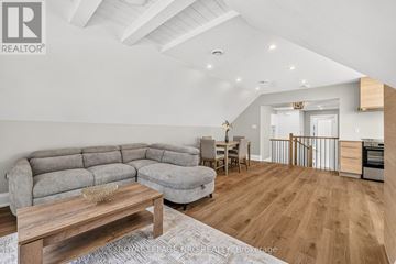 Niagara-On-The-Lake (Town) apartment for rent - A living room with a grey sofa and a wooden coffee table.