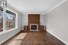 Toronto (Willowdale East) apartment for rent - A large, empty room with a fireplace and wood flooring.