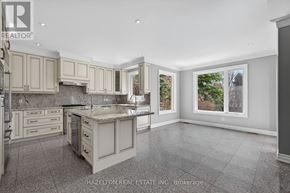 Toronto (Willowdale East) apartment for rent - A large, empty kitchen with a marble countertop and tiled floor.
