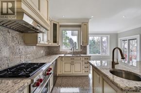 Toronto (Willowdale East) apartment for rent - A kitchen with a stove top oven and a sink.