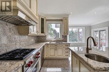 Toronto (Willowdale East) apartment for rent - A kitchen with a stove top oven and a sink.