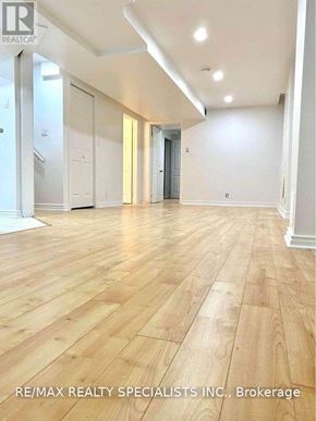 Vaughan (Sonoma Heights) apartment for rent - A spacious room with wooden flooring and white walls.