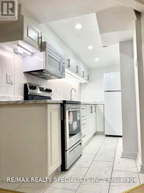 Vaughan (Sonoma Heights) apartment for rent - A modern kitchen with white cabinets and appliances.