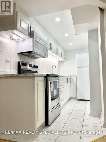 Vaughan (Sonoma Heights) apartment for rent - A modern kitchen with white cabinets and appliances.
