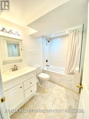 Vaughan (Sonoma Heights) apartment for rent - A white bathroom with a toilet, sink, and bathtub.