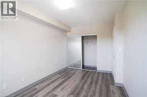 Waterloo apartment for rent - A room with a wooden floor and white walls.