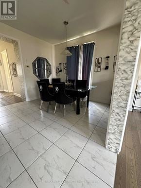 Brantford apartment for rent - A dining room with a table and chairs.