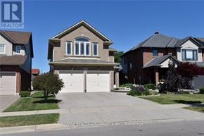 Hamilton (Kernighan) multi-family for rent - A house with a garage is shown in the image.