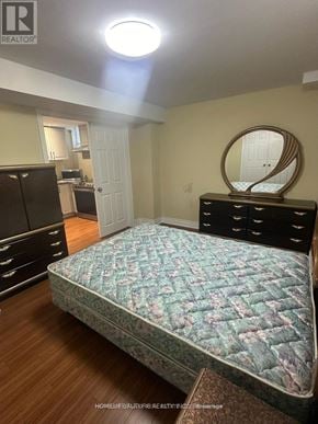 Whitby (Brooklin) apartment for rent - A bedroom with a bed, dresser, and mirror.