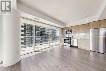 Toronto (Humber Heights) condo for rent - A modern kitchen with wooden cabinets and stainless steel appliances.