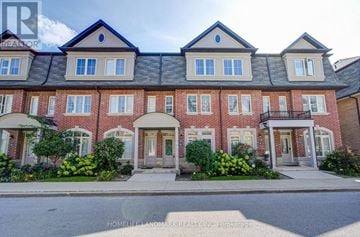 Toronto (L'amoreaux) townhouse for rent - A row of townhouses with a sign that says "HOMELIFE LANDMARK REALTY INC Brokerage".