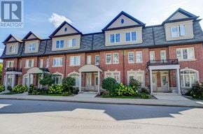 Toronto (L'amoreaux) townhouse for rent - A large brick building with multiple windows and balconies is shown.