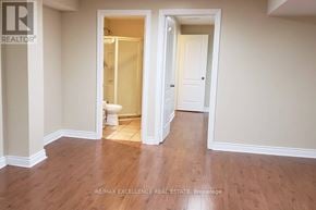 Mississauga (Churchill Meadows) apartment for rent - A room with a toilet and a doorway leading to another room.