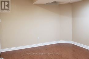 Mississauga (Churchill Meadows) apartment for rent - A room with a wooden floor and beige walls.