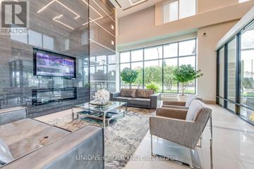 Mississauga (City Centre) condo for rent - A modern living room with a large television and comfortable seating.