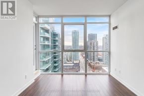 Mississauga (Creditview) condo for rent - A room with a large window overlooking a cityscape.