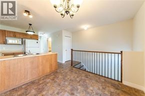 Waterloo townhouse for rent - A well-lit kitchen area with a wooden countertop and a chandelier.