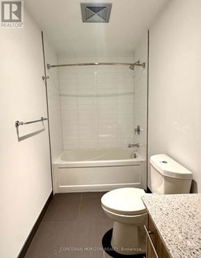 Kitchener condo for rent - A white toilet sits in a small bathroom with a walk-in shower.