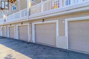 Ottawa condo for rent - A row of garage doors in front of a building.