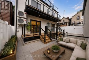 Toronto (Casa Loma) multi-family for rent - A modern house with a balcony and a patio area.