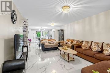 Azilda apartment for rent - A living room with a brown sofa and a glass door.