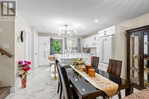 Azilda apartment for rent - A modern kitchen with a dining table set for four.