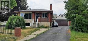 Kitchener apartment for rent - A house with a black car in front of it.