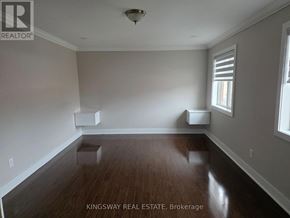 Brampton (Credit Valley) apartment for rent - A room with wooden floors and white walls, with a window on the right side.