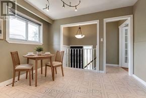 Newmarket (Bristol-London) apartment for rent - A dining room with a table set for two and a chandelier.