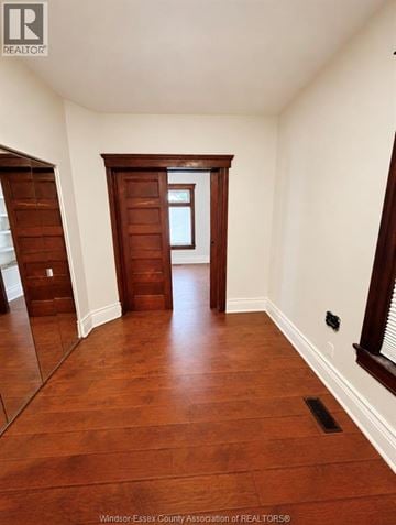 Windsor apartment for rent - A hallway with wood floors and white walls.