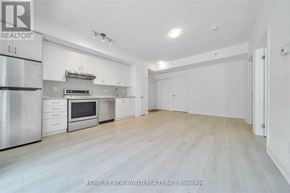 Markham (Wismer) condo for rent - A spacious kitchen with white cabinets and stainless steel appliances.