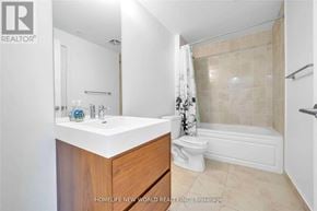 Markham (Wismer) condo for rent - A bathroom with a sink, toilet, and bathtub.
