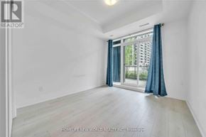 Markham (Wismer) condo for rent - A room with a window and a wooden floor.