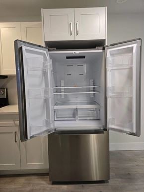 Mission apartment for rent - A stainless steel refrigerator with its door open in a kitchen.