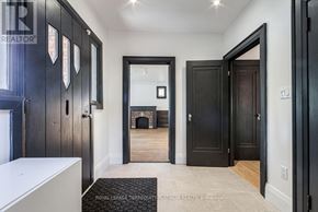 Toronto (Willowdale West) apartment for rent - A hallway with black doors and a white counter.