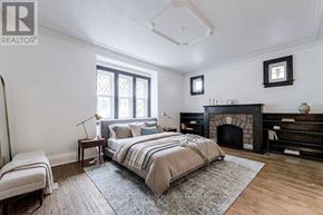 Toronto (Willowdale West) apartment for rent - A bedroom with a large bed and a fireplace.