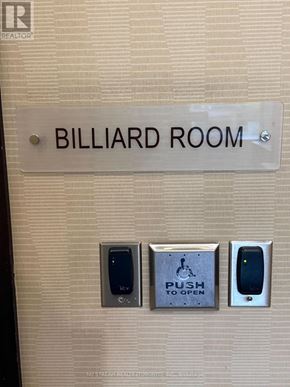 Markham (Unionville) condo for rent - A white toilet with a tank and a toilet paper holder.