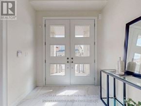 Whitchurch-Stouffville (Ballantrae) apartment for rent - A white door with a glass window is in the middle of a room.