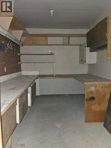 Maple Ridge apartment for rent - A kitchen under construction with wooden cabinets and a countertop.