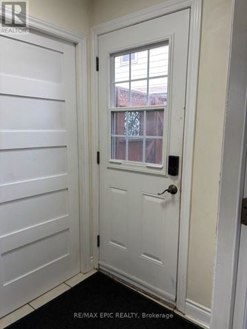 Mississauga (Erindale) apartment for rent - A white door with a window in the middle.