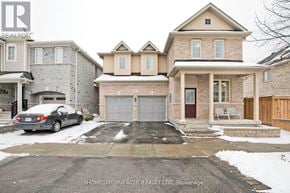 Ajax (Central East) apartment for rent - A house with a car parked in front of it.
