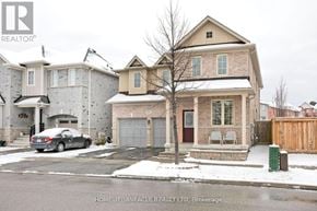 Ajax (Central East) apartment for rent - A house with a car parked in front of it.