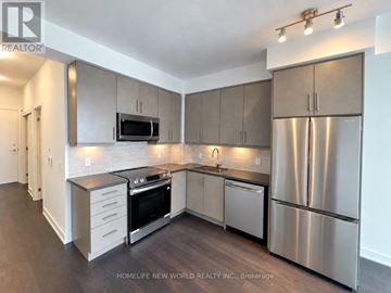 Richmond Hill (Langstaff) condo for rent - A modern kitchen with stainless steel appliances and wooden floors.