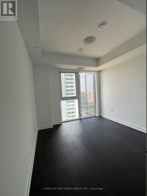 Richmond Hill (Langstaff) condo for rent - A room with a sliding glass door leading to a balcony.