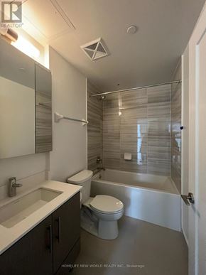 Richmond Hill (Langstaff) condo for rent - A bathroom with a toilet, sink, and shower.